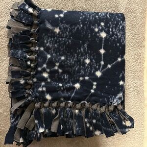 50x60” fleece tie blanket. Galaxy pattern fleece with gray fleece backing.